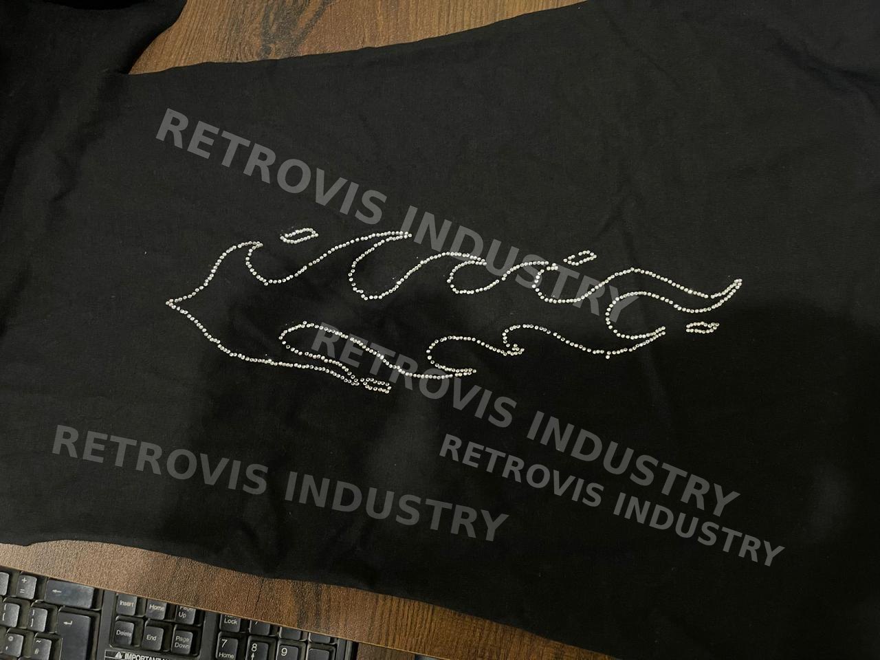 Embroidery machine stitching a logo